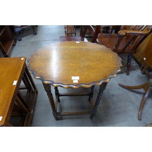 136 - An oval oak barleytwist occasional table