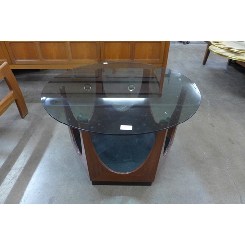 14 - A G-Plan teak and glass topped circular coffee table