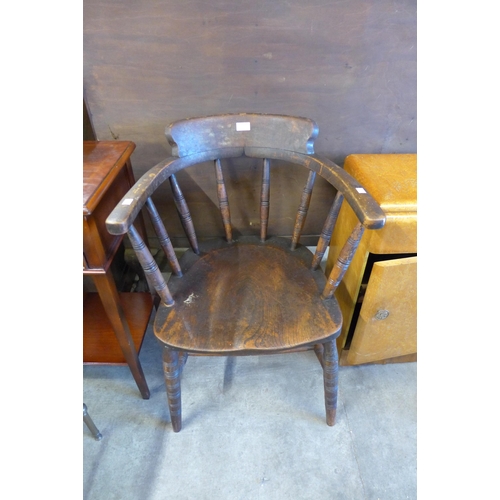 143 - A Victorian elm and beech smokers bow chair