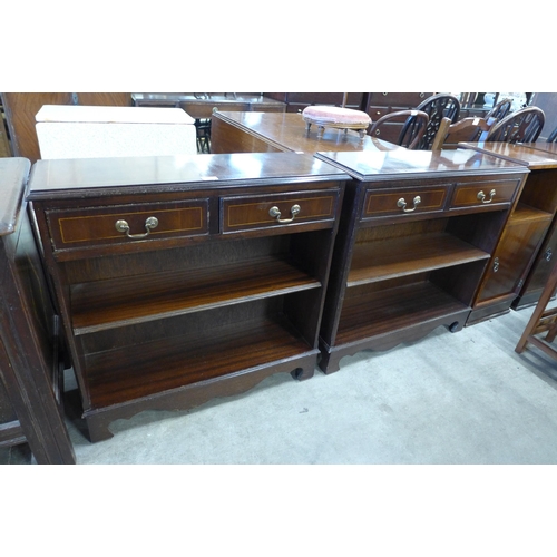 152 - A pair of inlaid mahogany open bookcases