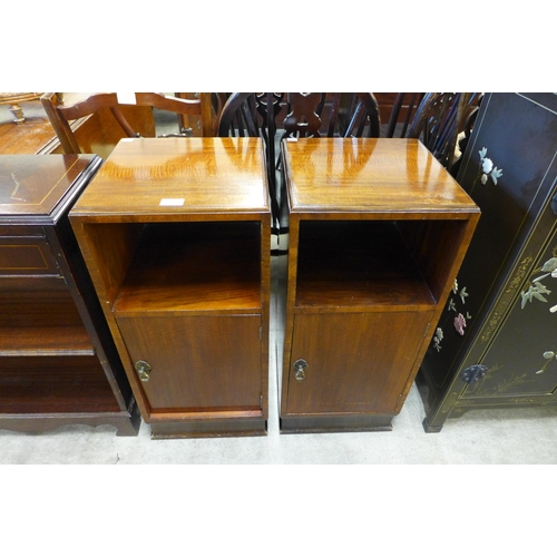 153 - A pair of walnut pot cupboards