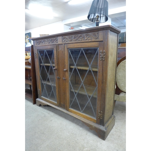 157 - A carved oak bookcase