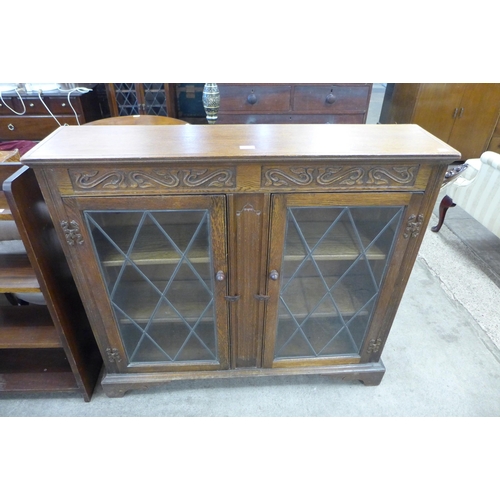 157 - A carved oak bookcase