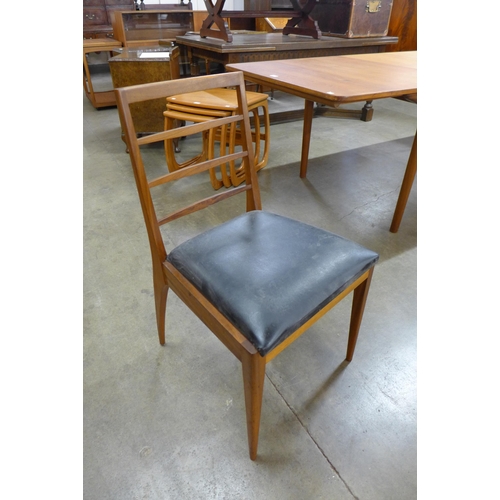 16 - A set of four McIntosh teak dining chairs