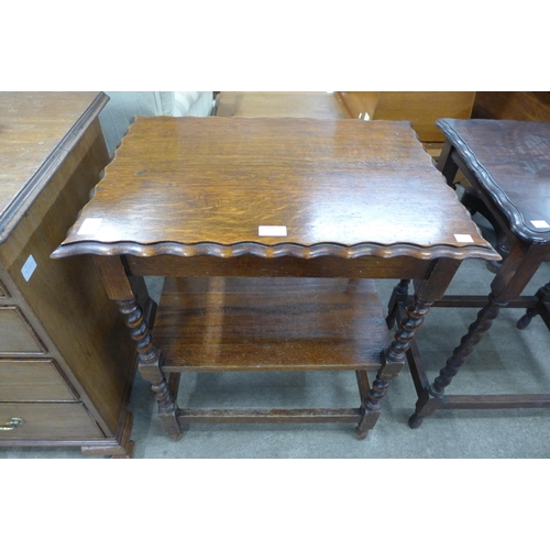 160 - An oak barleytwist three tier occasional table