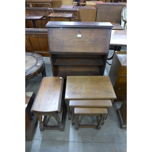 177 - An oak student's bureau, an oak gateleg occasional table and a nest of tables