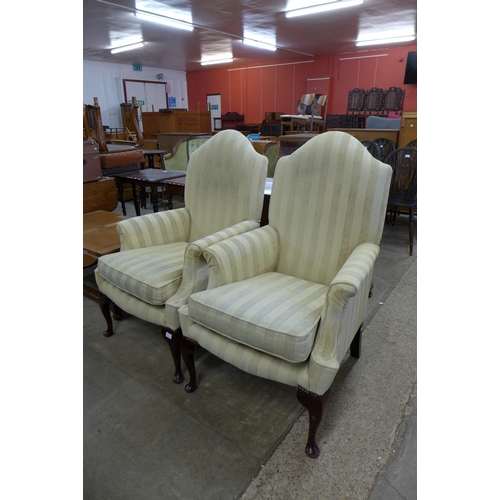 183 - A pair of Queen Anne style mahogany and fabric upholstered armchairs