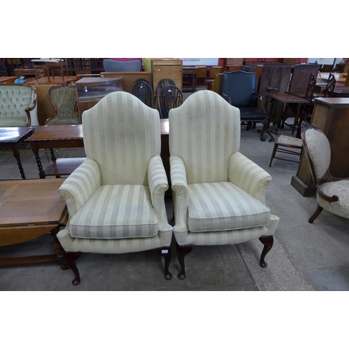 183 - A pair of Queen Anne style mahogany and fabric upholstered armchairs