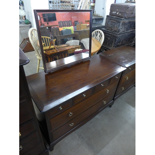 207 - A Stag Minstrel mahogany chest of drawers and dressing chest