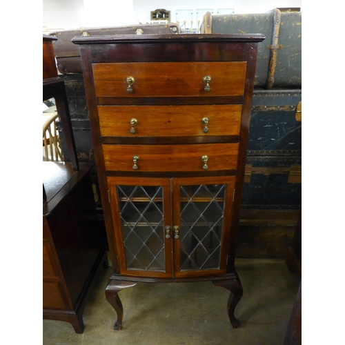 209 - An Edward VII mahogany bow front music cabinet