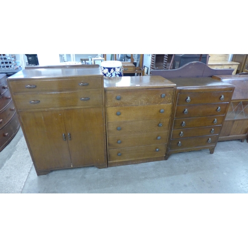 211 - An oak tallboy and two oak chests of drawers