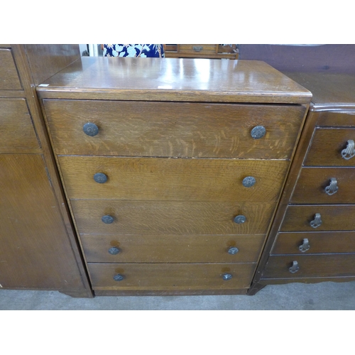 211 - An oak tallboy and two oak chests of drawers