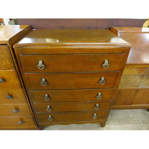 211 - An oak tallboy and two oak chests of drawers