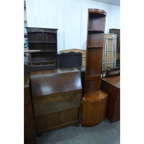 212 - A walnut bureau, an inlaid mahogany corner cabinet and a Nathan mahogany sideboard