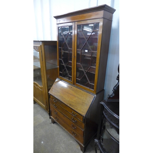 220 - An Edward VII inlaid mahogany bureau bookcase