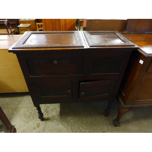 222 - A carved oak barleytwist gramophone cabinet, an early 20th Century mahogany sideboard, a walnut sing... 