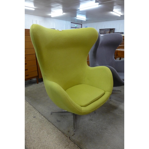 24 - An Arne Jacobsen style chrome and lime green fabric revolving egg chair