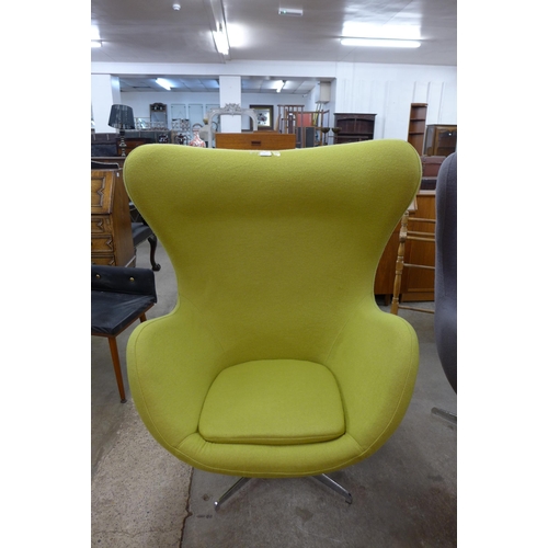 24 - An Arne Jacobsen style chrome and lime green fabric revolving egg chair