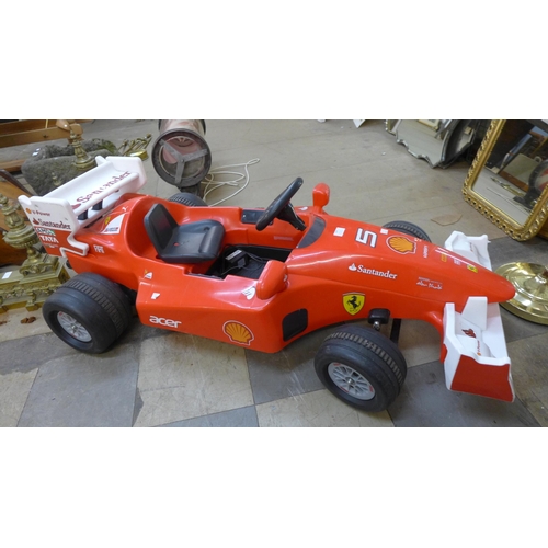 249 - A limited edition Ferrari F1 Indy ride on car, Formula 1 W112 volt battery power, with charging lead