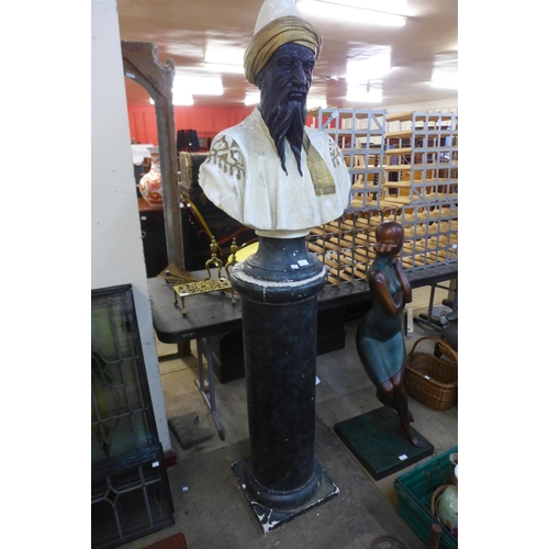 253 - A painted plaster bust of an Arabic man, on pedestal