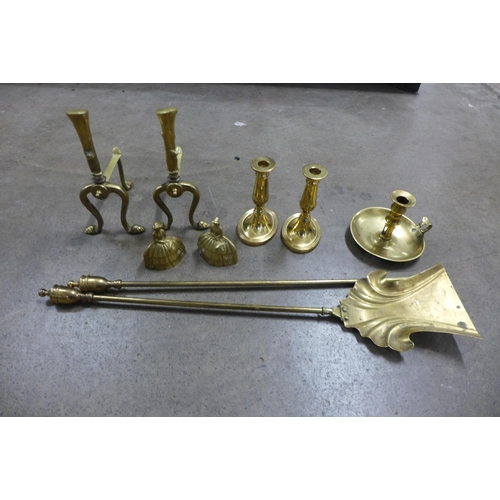 254 - Assorted brassware, including companion set, andirons and candlesticks, etc.