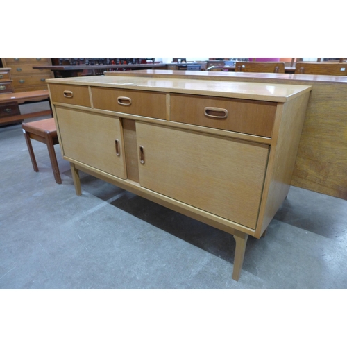 29 - A light oak sideboard