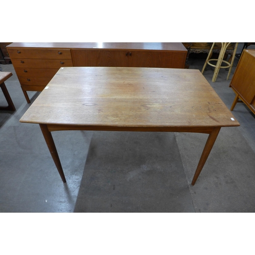 3 - A Danish teak extending dining table