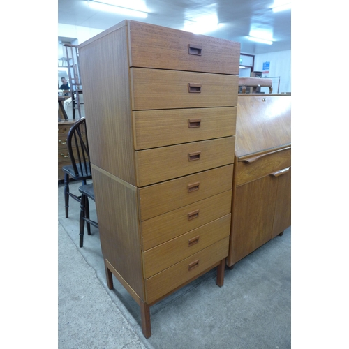 45 - A tall teak chest of drawers