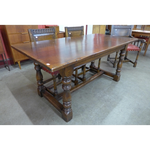 58 - An Ipswich oak refectory table ( 76cms h, 168cms l, 84cms w) and six chairs