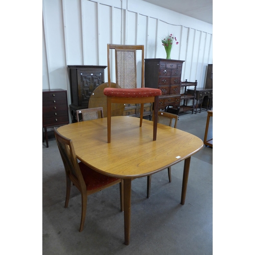 6 - A G-Plan teak extending dining table and four chairs