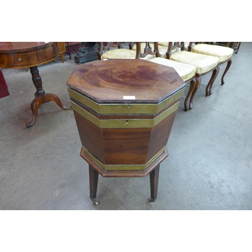 60 - A George III mahogany and brass banded octagonal wine cooler