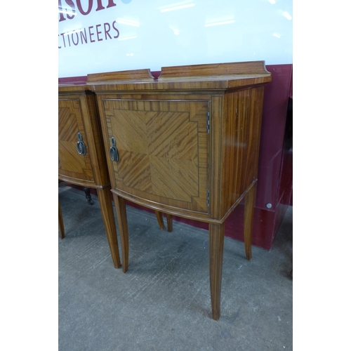 62 - A pair of Edward VII Waring & Gillows inlaid satinwood bow front night stands