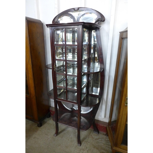 64B - A French Art Nouveau mahogany side cabinet