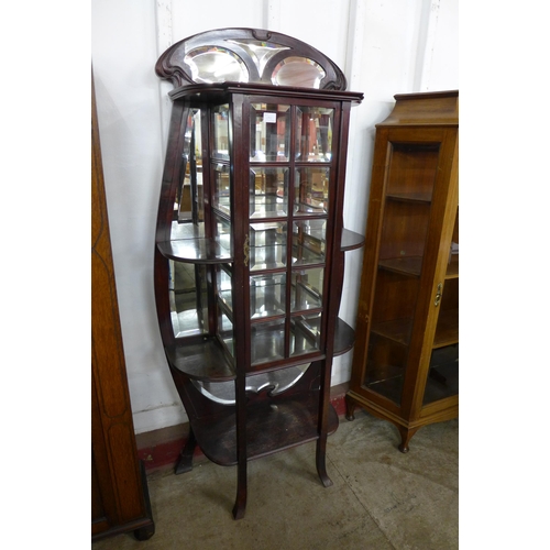 64B - A French Art Nouveau mahogany side cabinet