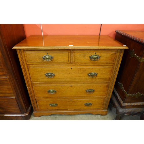 69 - A late Victorian walnut chest of drawers