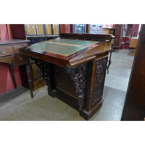 77A - An early Victorian rosewood fretwork Davenport desk, manufactured by J. Manuel, Sheffield