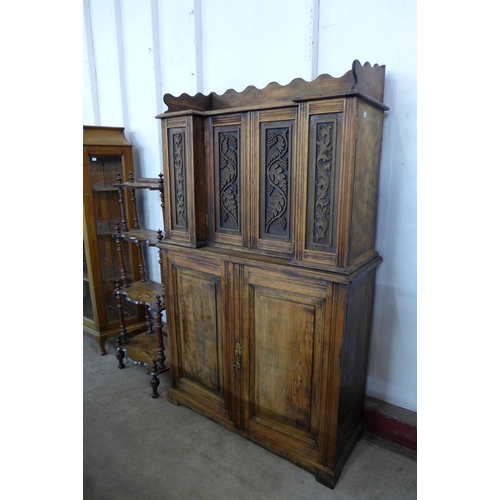 83E - A late 19th/early 20th Century French carved beech fitted six door cupboard