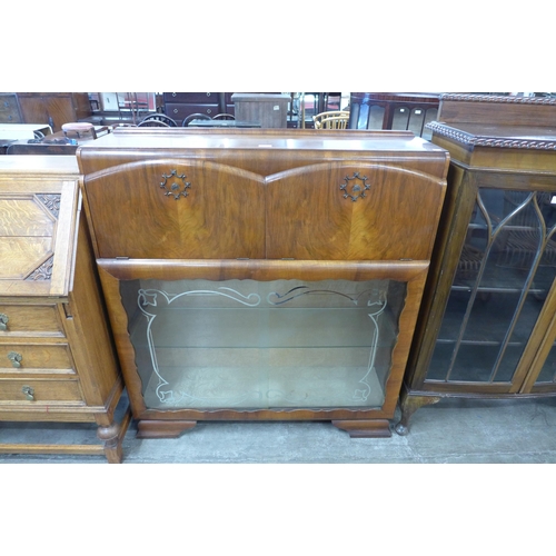 96 - An Art Deco walnut cocktail cabinet