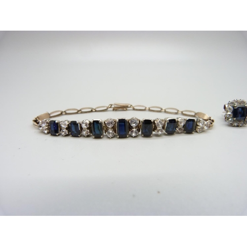 1014 - A yellow metal, blue and white sapphire bracelet and earrings, 14.1g