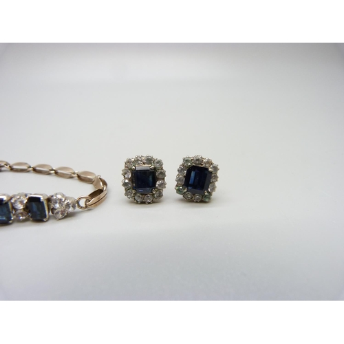 1014 - A yellow metal, blue and white sapphire bracelet and earrings, 14.1g