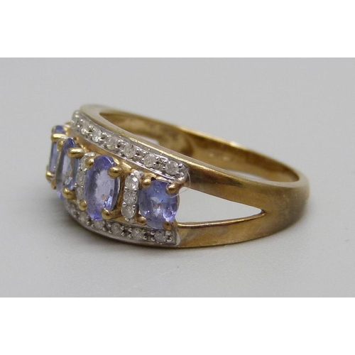 1041 - A 9ct gold, diamond and tanzanite cluster ring, 2.7g, M