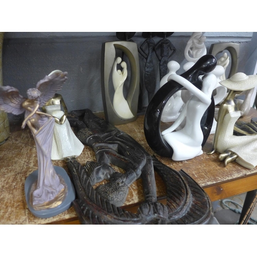 1055 - A collection of decorative figures and a wooden carving **PLEASE NOTE THIS LOT IS NOT ELIGIBLE FOR P... 