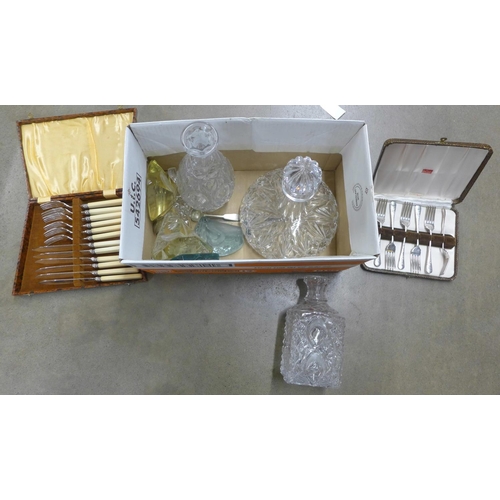 1073 - Three glass decanters, four glass paperweights, plated fish knives, etc. **PLEASE NOTE THIS LOT IS N... 