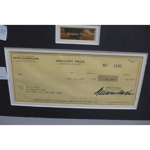 621 - A Gregory Peck autographed cheque and photograph display