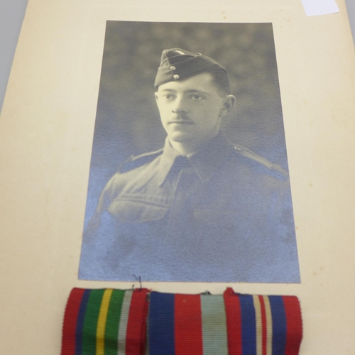 629 - A photograph of a soldier and three WWII medals including the Pacific Star