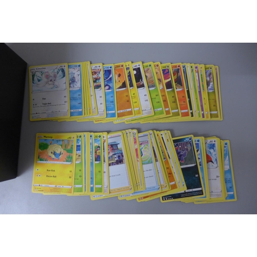 636 - 200+ Pokemon cards with dice, coins, protective sleeve etc.