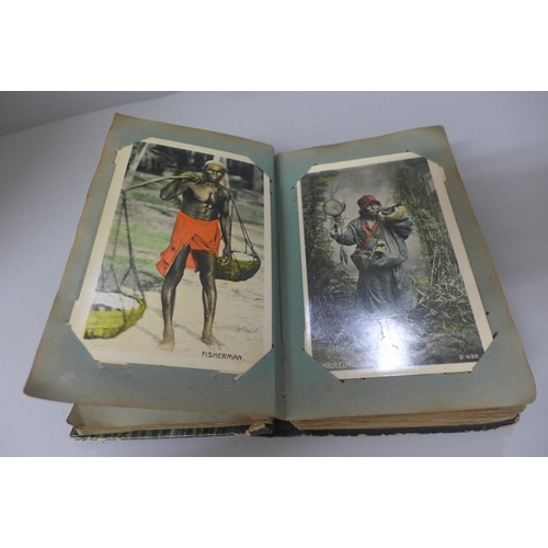 643 - A postcard album containing early 20th century Indian people, places and transport, snake charmers, ... 