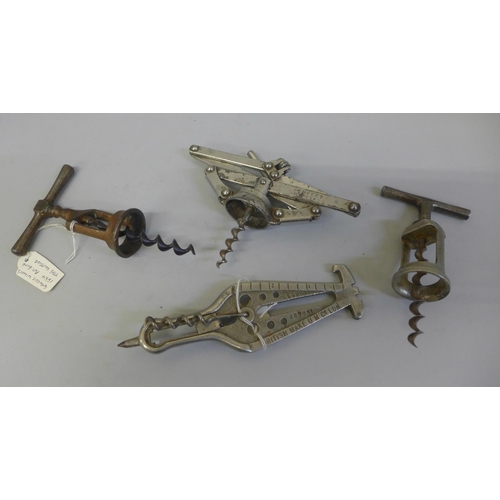 651 - A 19th Century corkscrew and three 20th Century corkscrews