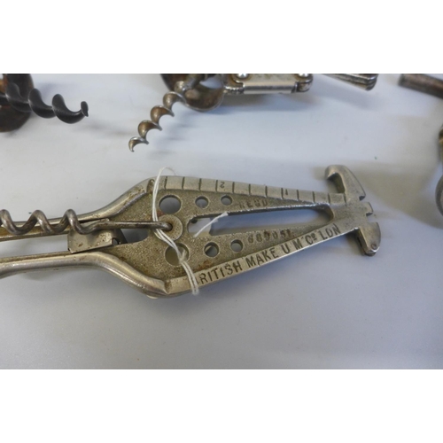 651 - A 19th Century corkscrew and three 20th Century corkscrews