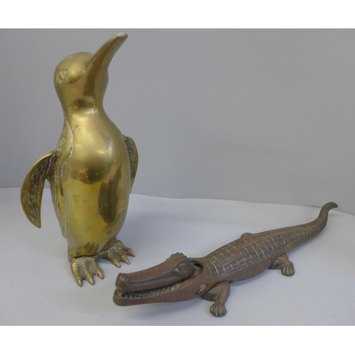 655 - A nutcracker in the form of a crocodile and a brass penguin